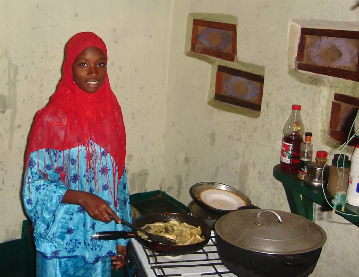 Chef in kitchen of Brufut Motel Restaurant